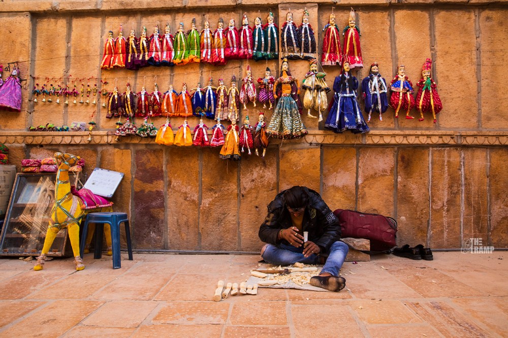 Jaisalmer Street View -Carpenter preparing wooden dolls